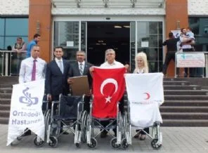 Suriyelilere tekerlekli sandalye bağışı