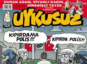 'Duran Adam' mizah dergisi kapaklarında duruyor