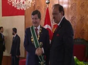 Davutoğlu'na devlet nişanı